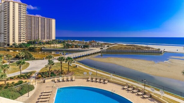 A hotel with a large pool, beach access, and a view of the ocean. - Oceanfront! - All New! Ultra Modern Farmhouse Chic at the Beach! (Myrtle Beach)