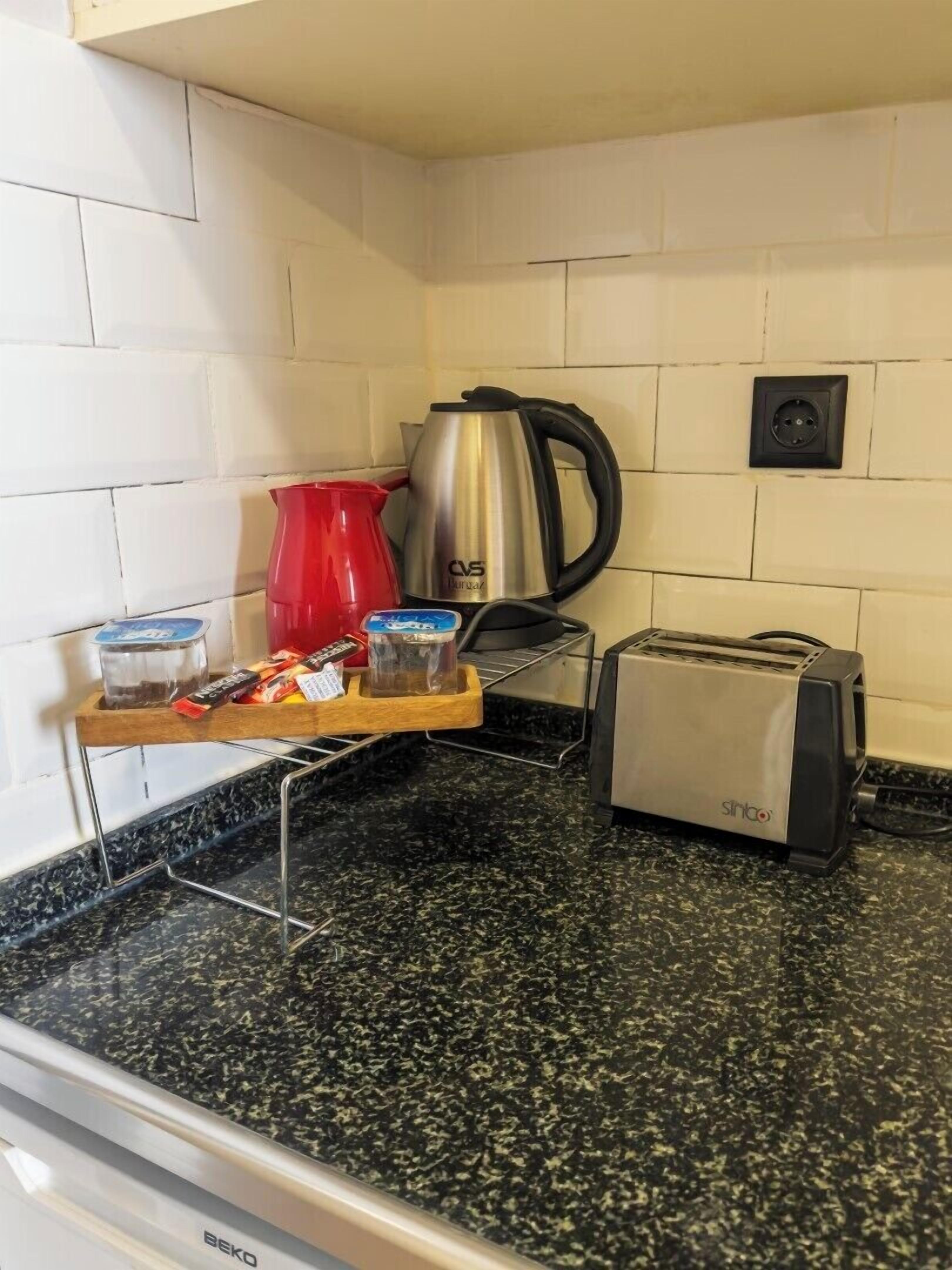 Hypo-allergenic bedding, desk, laptop workspace, blackout curtains