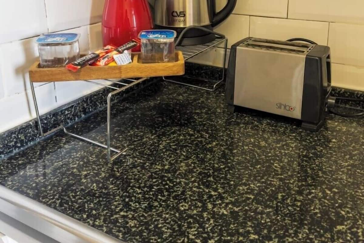 Hypo-allergenic bedding, desk, laptop workspace, blackout curtains