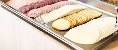 A display case with various food items including sliced bread and pastries.