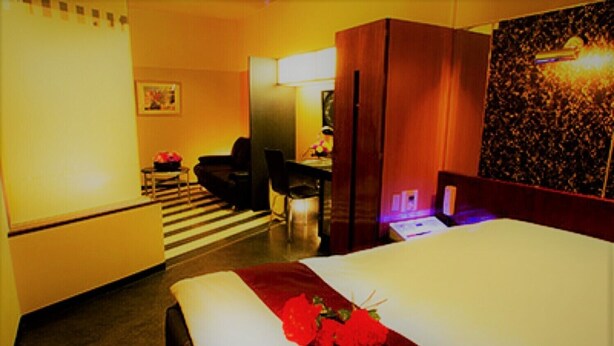 A hotel room with a bed, a desk, a chair, and a sofa. - LA.FESTA - Adults Only (Takamatsu)