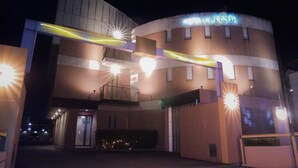 A building with a curved facade, a sign reading "FESTA," and multiple light fixtures. - LA.FESTA - Adults Only (Takamatsu)