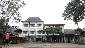 A building with a sign reading "Ritz Hotel" and a smaller sign for "1 Residence." - I Residence Bandung (Bandung)
