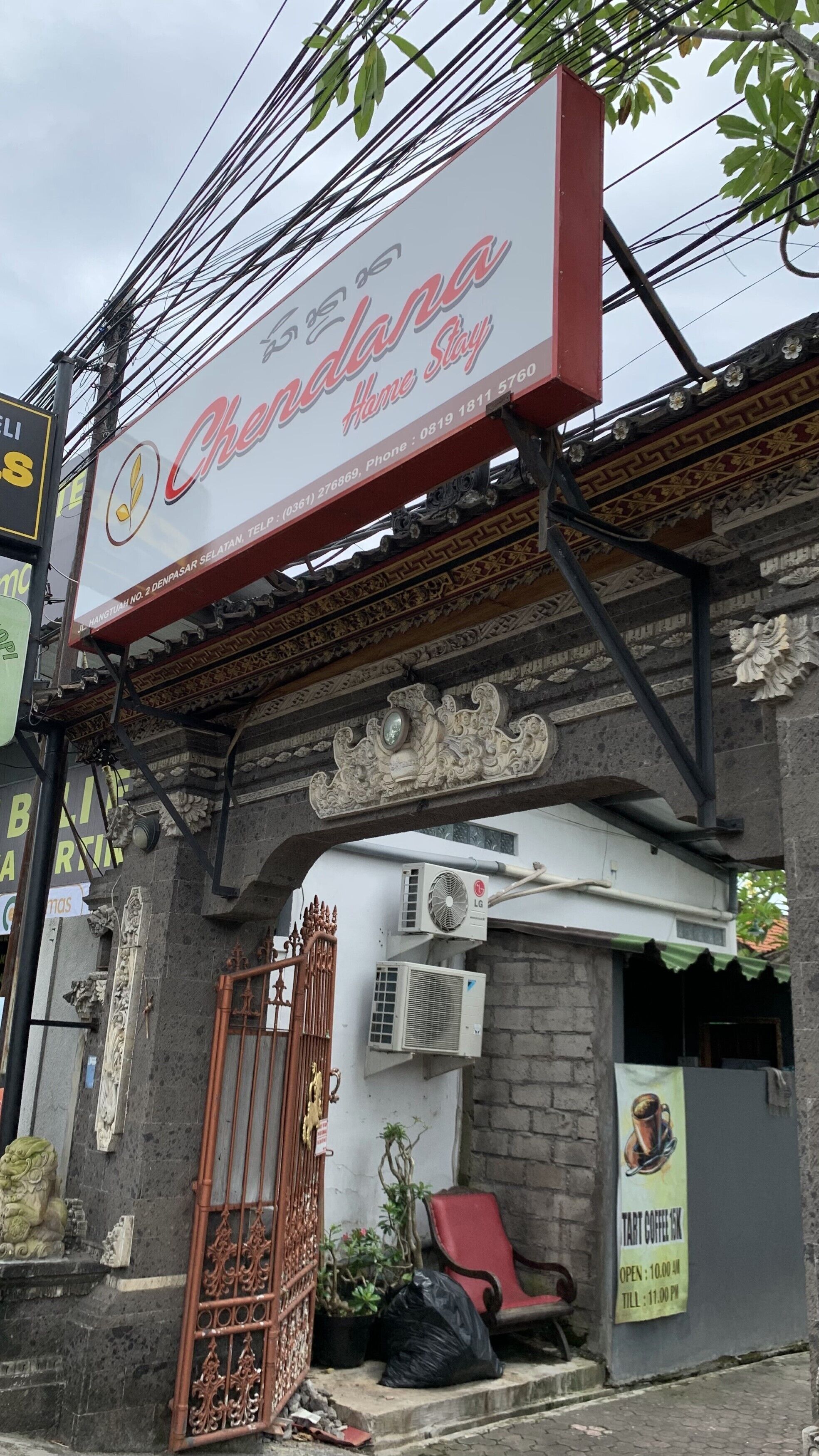 A building with a sign for 'Chandana Home Stay' and a 'Tart Coffee Shop' sign.