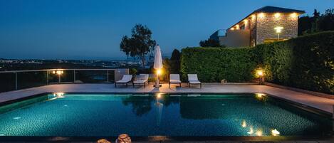 Outdoor pool, a heated pool, sun loungers