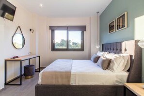 A modern bedroom with a bed, bedside table, lamp, and a large window. - Villa Vega Heated* pool, next to nature! (Chania)