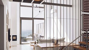 A modern interior with a staircase, a seating area, and large windows. - Omnia Villa l - Heated* pool & stunning Seaview! (Chania)