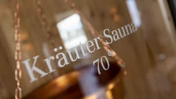 Un letrero con el texto 'Kräuter Sauna 70°'.