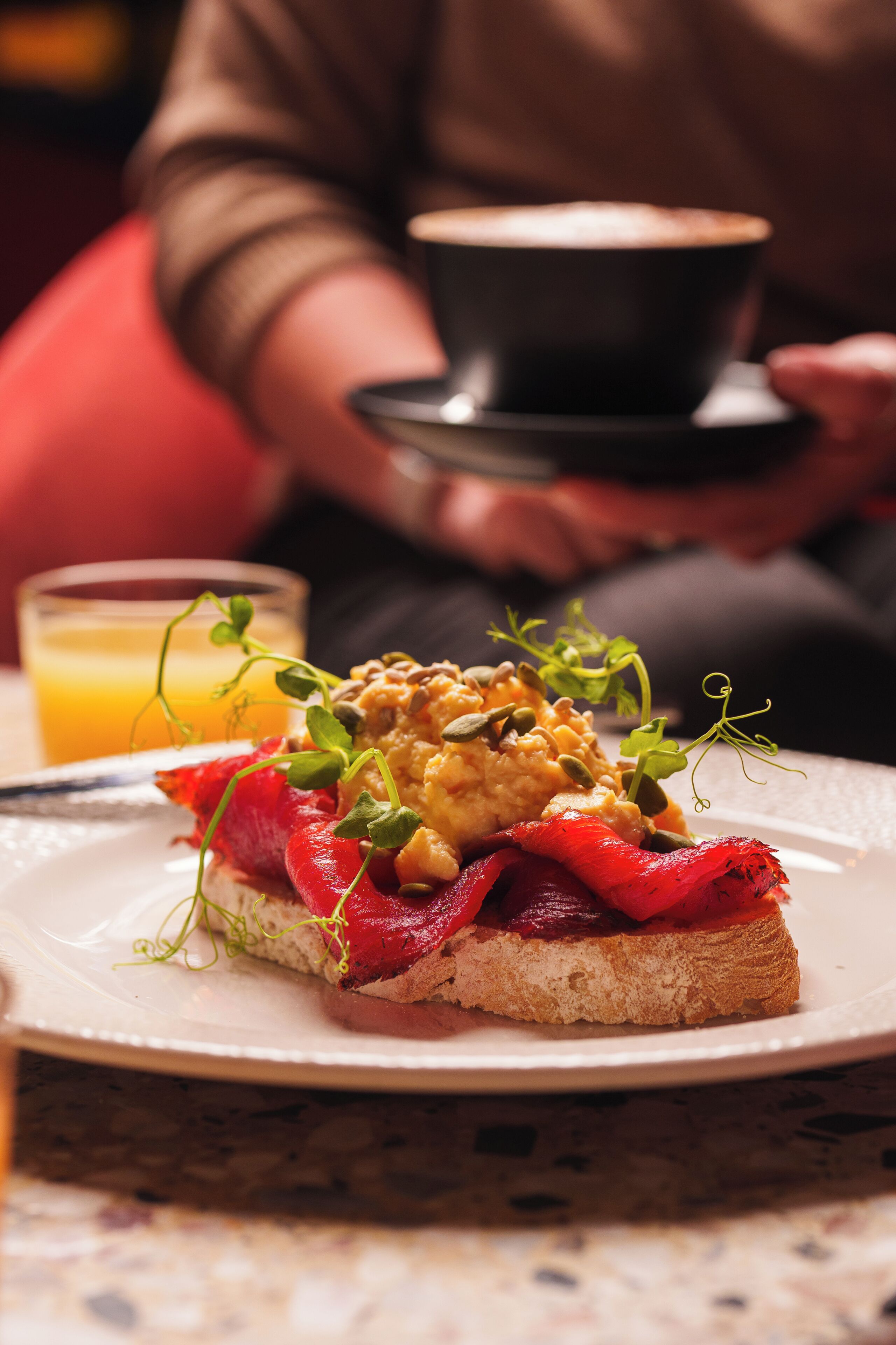 A plate of food with a cup of coffee.