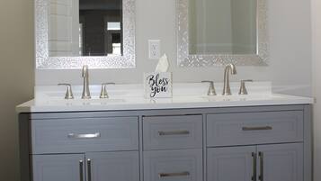 Combined shower/tub, hair dryer, towels, soap