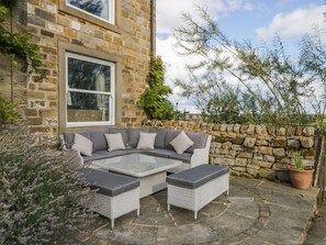 A stone building with a large window and a stone wall. - Meagill Farmhouse, hot Tub, bbq hut (Otley)