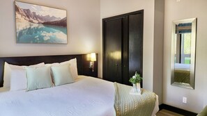 1 bedroom, desk, iron/ironing board, travel crib