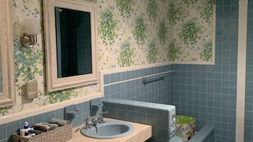 Combined shower/tub, hair dryer, towels, soap