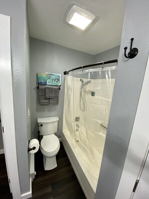 Combined shower/tub, hair dryer, towels, soap