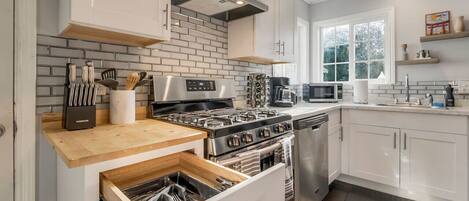 Fridge, coffee/tea maker, cookware/dishes/utensils