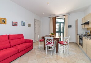 Family Apartment, Multiple Bedrooms (Domos Pintadas Apt. 1 Porto Rotondo) | Living area | 21-inch TV with cable channels