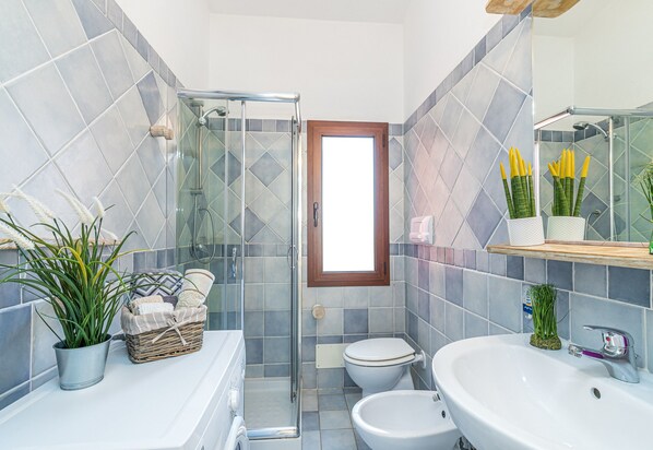 Family Apartment, Multiple Bedrooms (Domos Pintadas Apt. 1 Porto Rotondo) | Bathroom | Shower, hair dryer, bidet, towels