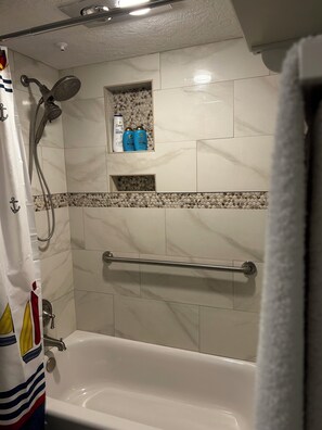 Combined shower/tub, hair dryer, towels, soap