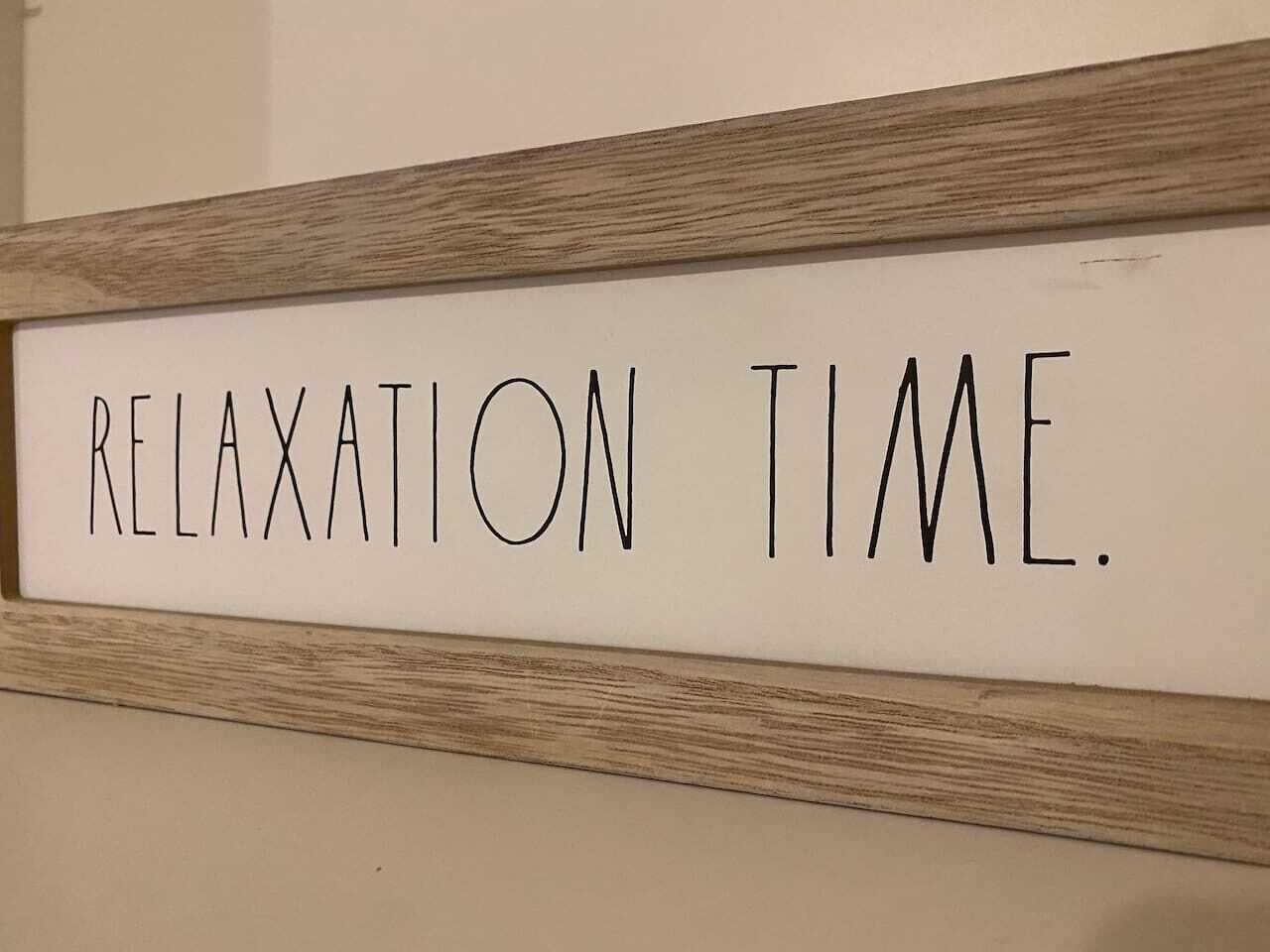 A sign with the text "RELAXATION TIME."