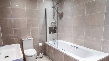 Deep soaking tub, designer toiletries, hair dryer, towels