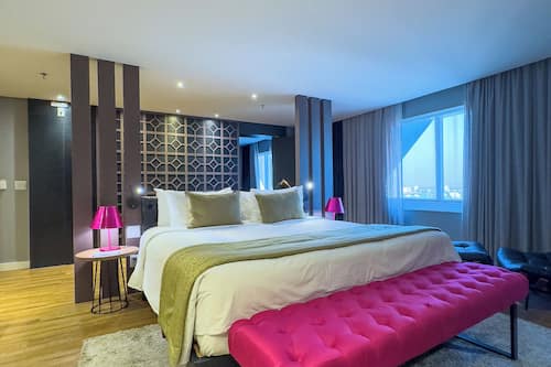 Senior Suite | Minibar, in-room safe, desk, laptop workspace