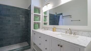 Combined shower/tub, hair dryer, towels, soap