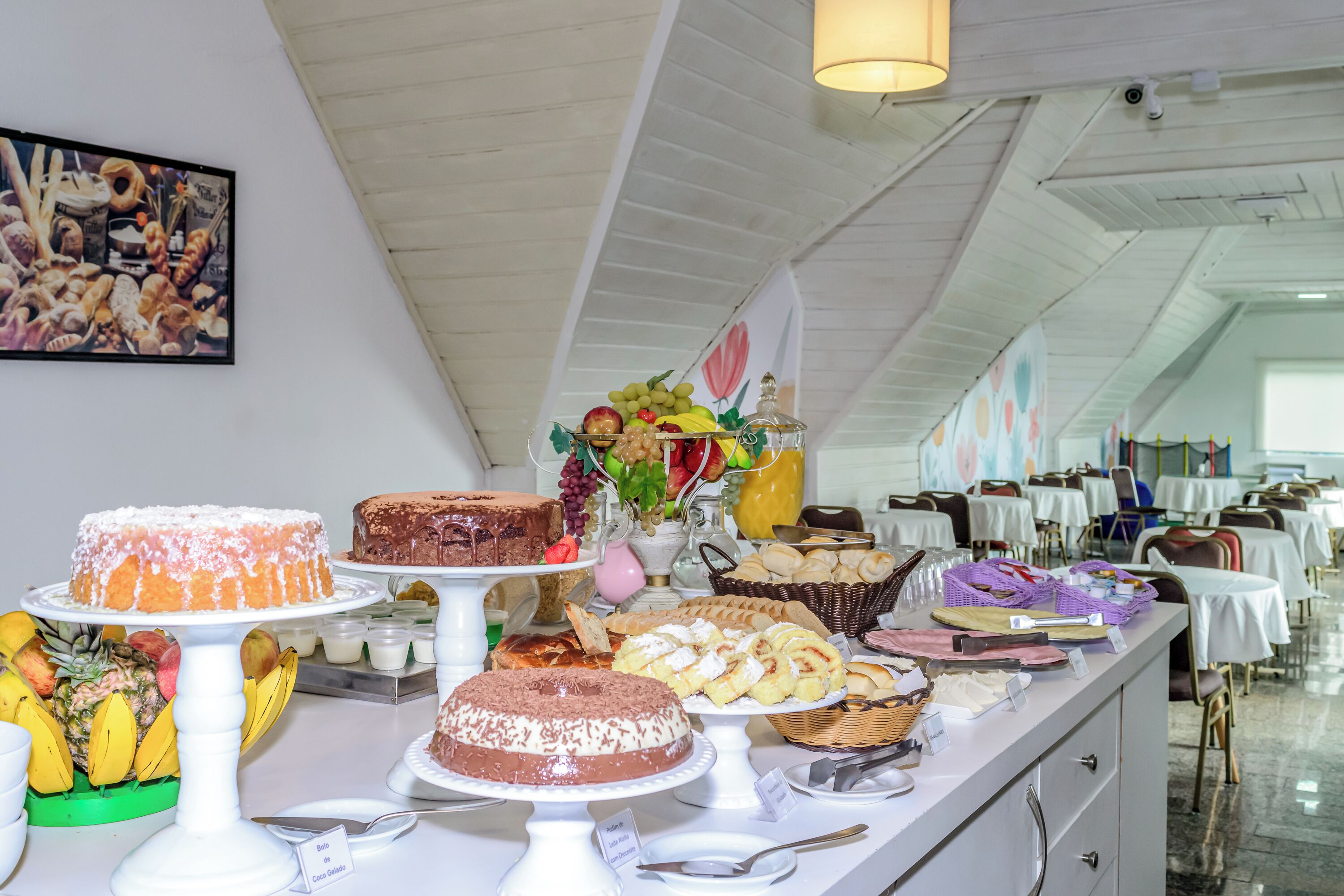A buffet with various desserts and fruits.