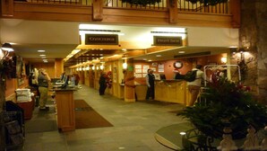 A hotel lobby with a concierge desk, a front desk, and a reception area. - Fabulous Ski In and Ski Out Condo at Grand Timber Lodge in Breckenridge, CO (Breckenridge)