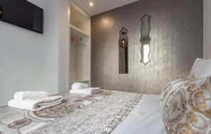 2 dormitorios, tabla de planchar con plancha, wifi gratis y ropa de cama