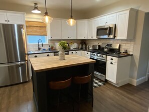 Dishwasher, blender, dining tables