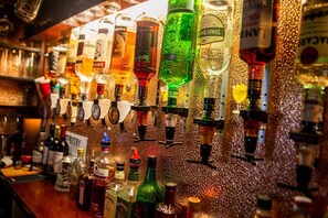 A bar with various liquor bottles and glasses on shelves. - Ferndale Hotel (Blackpool)