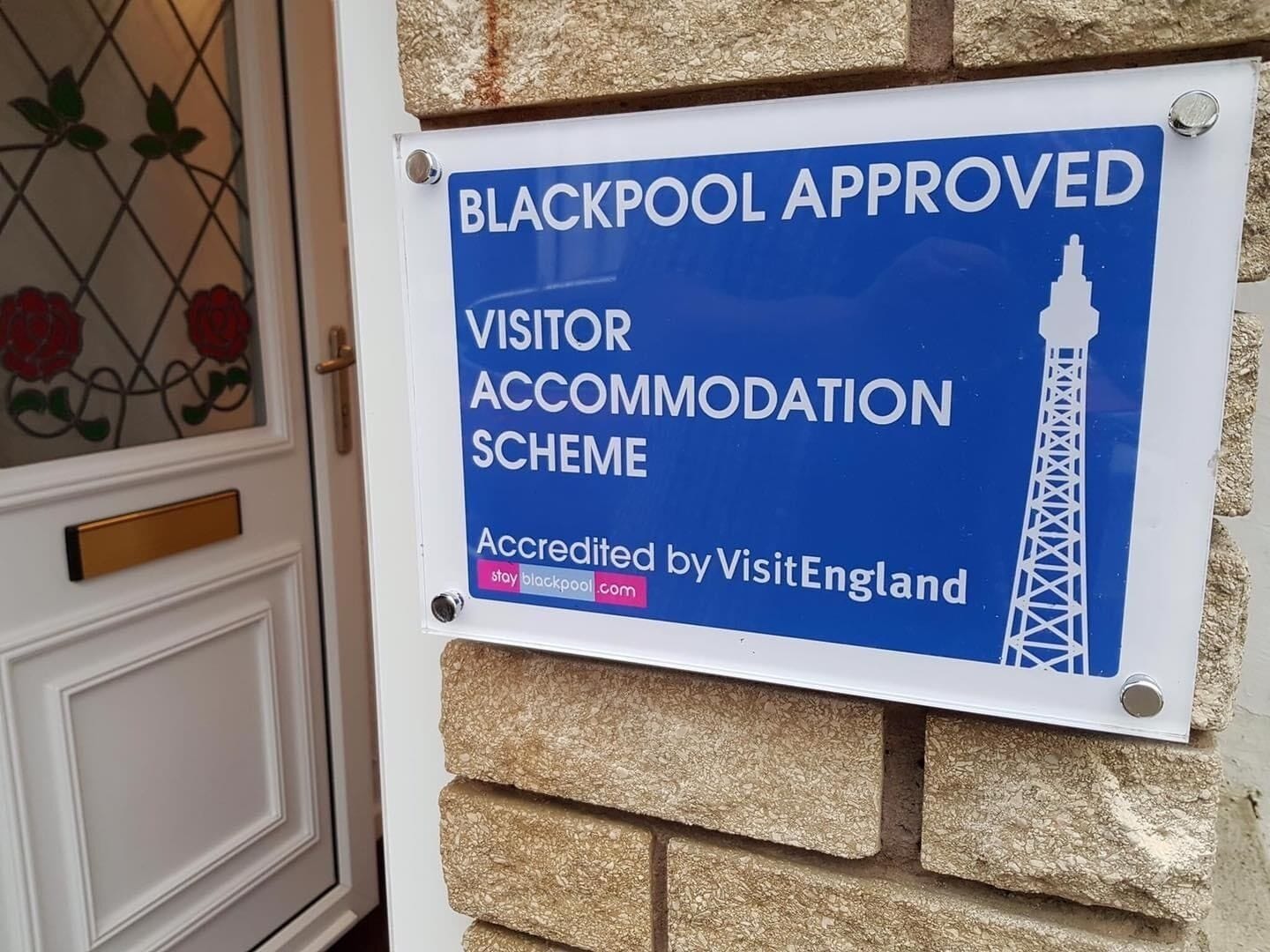 A sign indicating Blackpool's approved visitor accommodation scheme, accredited by VisitEngland.