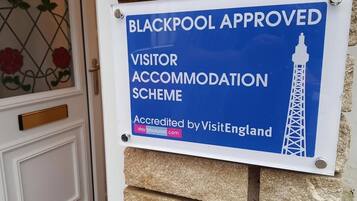 A sign indicating Blackpool's approved visitor accommodation scheme, accredited by VisitEngland.