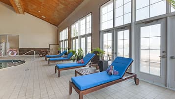 Indoor pool, open 9:00 AM to 9:00 PM, pool loungers