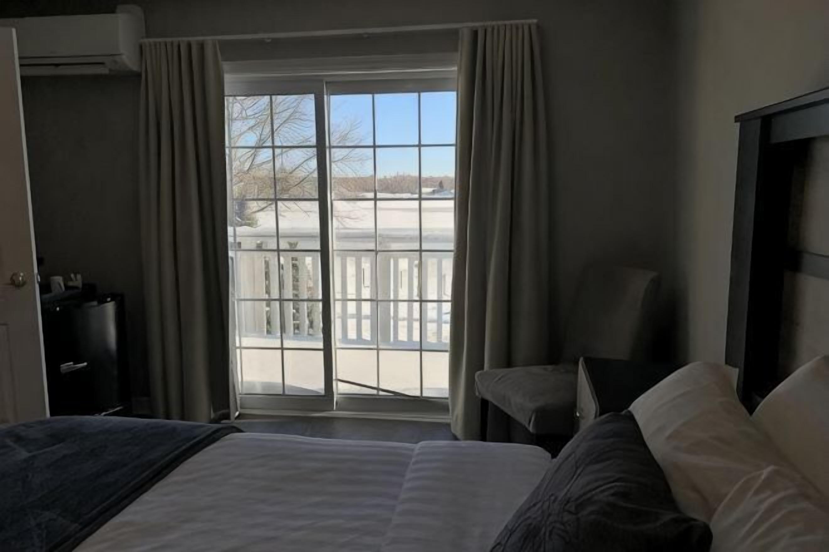 Tempur-Pedic beds, desk, laptop workspace, blackout curtains