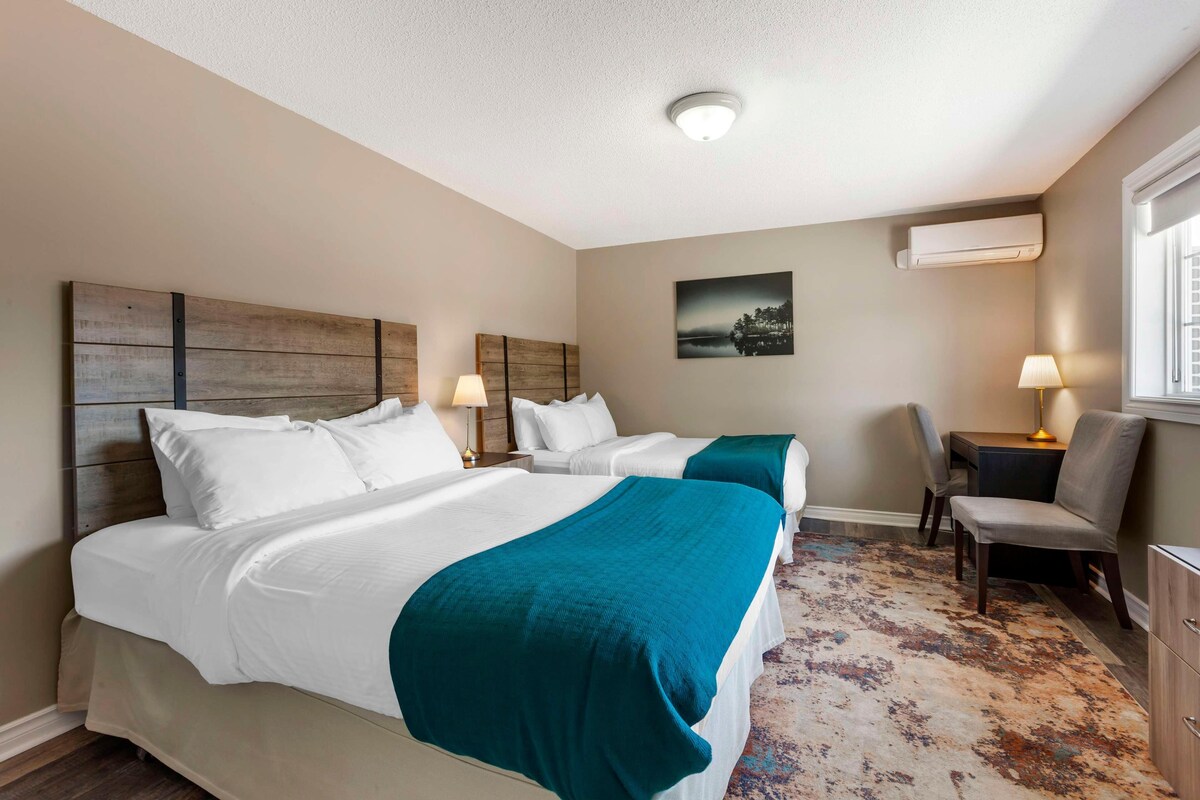 Tempur-Pedic beds, desk, laptop workspace, blackout curtains