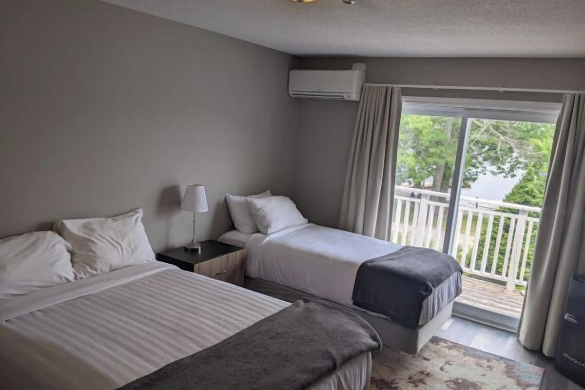 Tempur-Pedic beds, desk, laptop workspace, blackout curtains