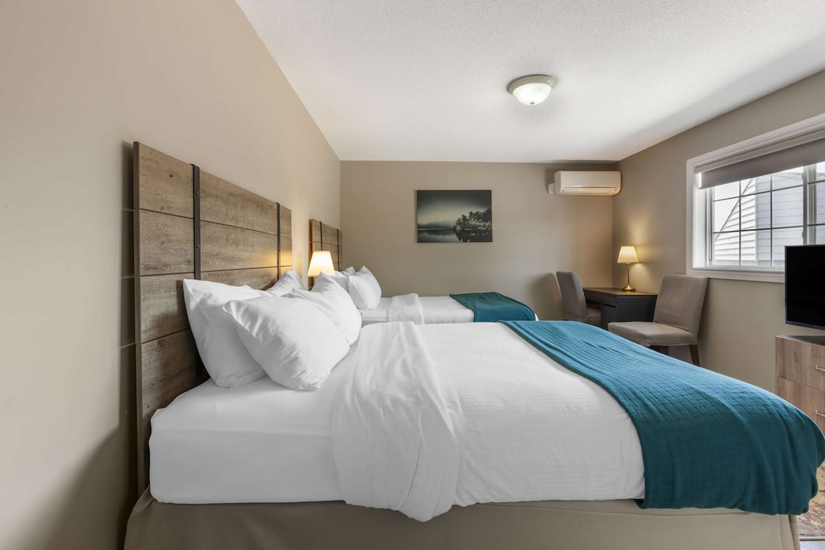 Tempur-Pedic beds, desk, laptop workspace, blackout curtains