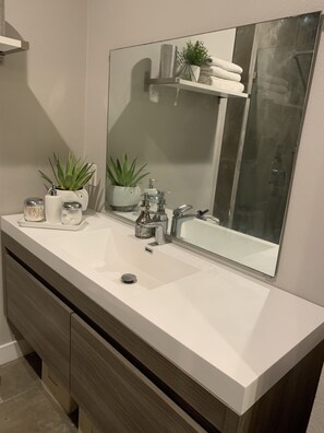 Shower, hair dryer, towels, toilet paper