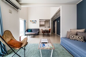 Unit B | Living area | 24-inch TV with digital channels - Chura Palace (Motobu)