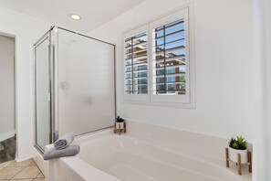 Combined shower/tub, hair dryer, towels, soap