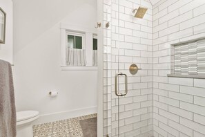 Shower, hair dryer, towels, shampoo