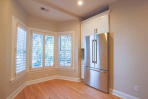 Enjoy cooking in this well-equipped kitchen with a refrigerator, oven, and ample cabinetry.