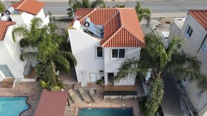A residential property with a swimming pool, a covered patio, and a red-tiled roof. - Villa Sirena - Pernera (Paralimni)