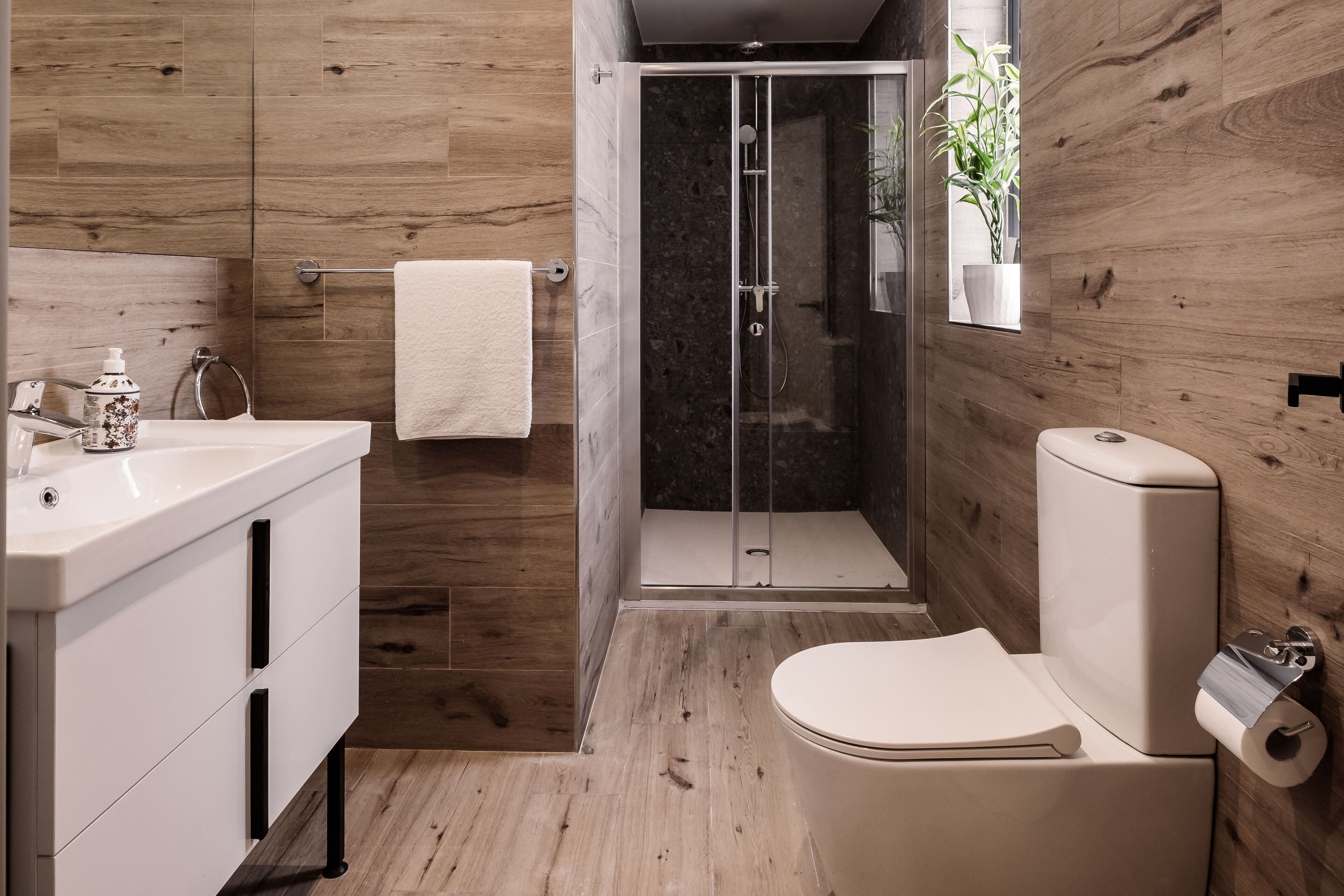 shower, designer toiletries, hair dryer, towels