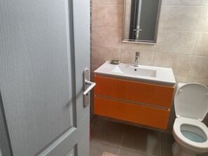 Shower, hair dryer, towels, toilet paper