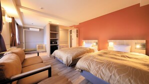 A hotel room with two beds, a sofa, a desk, and a wardrobe. - Yutorelo Garden Kitakaruizawa (Tsumagoi)