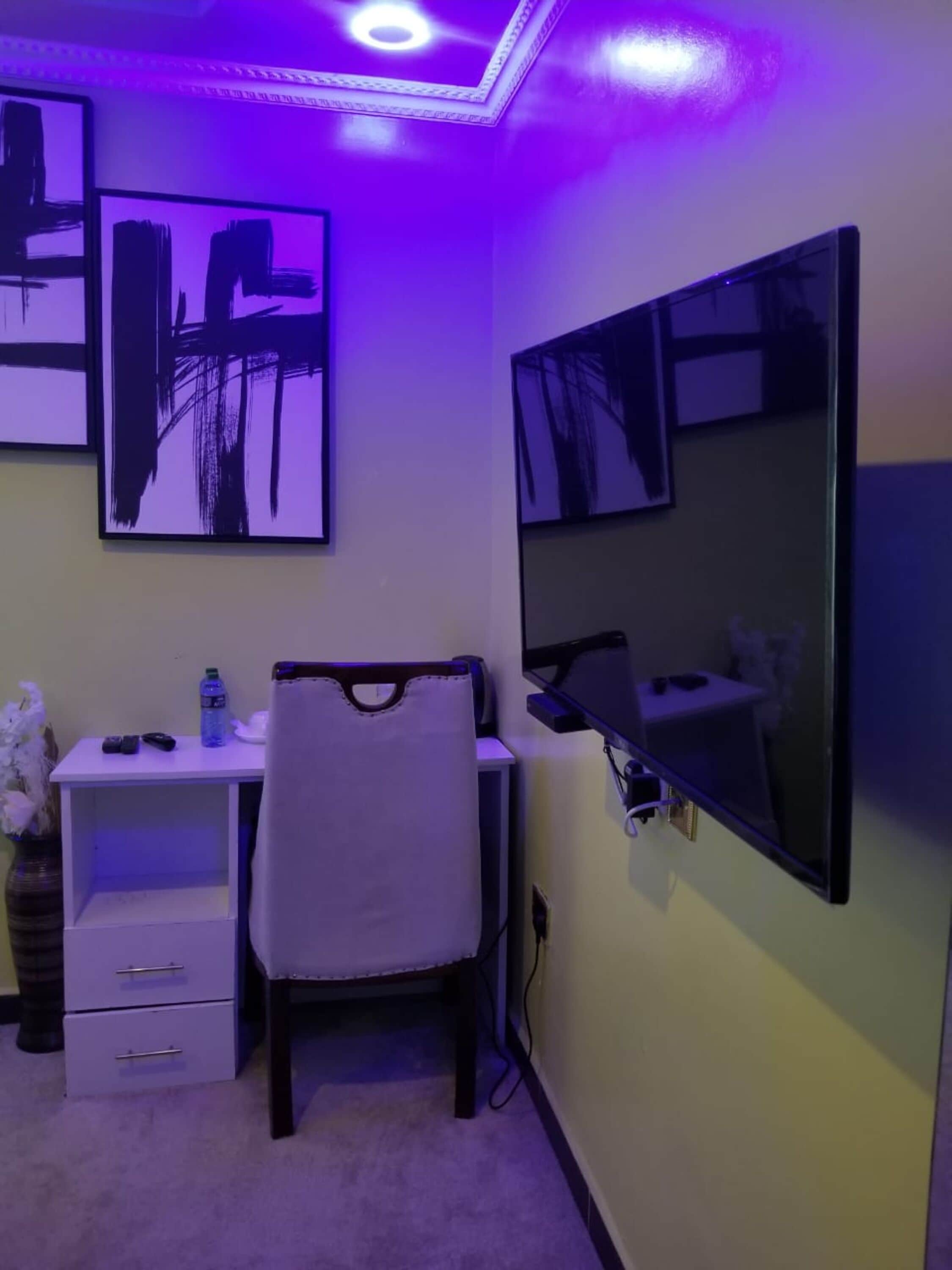 desk, laptop workspace, bed sheets