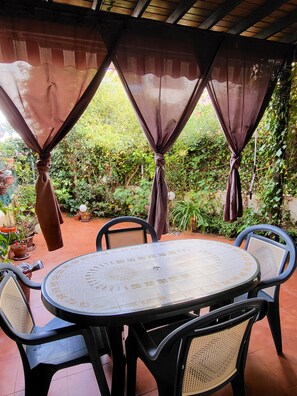 Outdoor dining - Beautiful low house with private naturist garden! (Vera)
