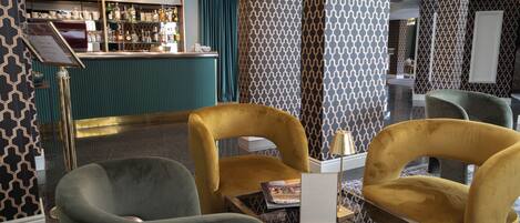 A bar area with a counter and seating.